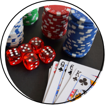 image of playing cards, dice and pocker chips